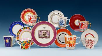 1368. A set of seven Russian commemorative cups with saucers and a dinner plate, 20th Century. Some Lomonosov.