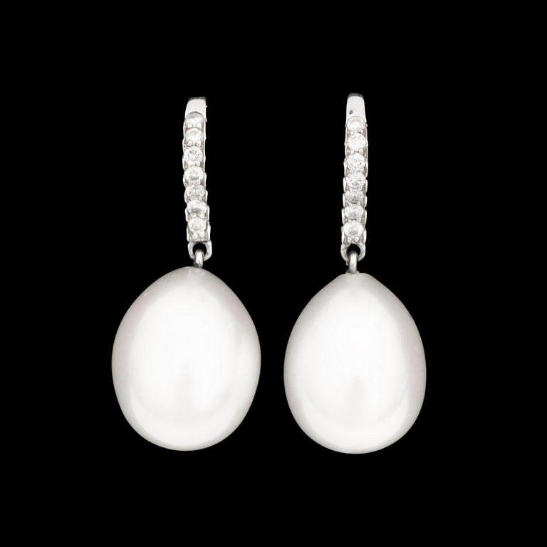 A pair of cultured pearl earrings set with brilliant-cut diamonds.