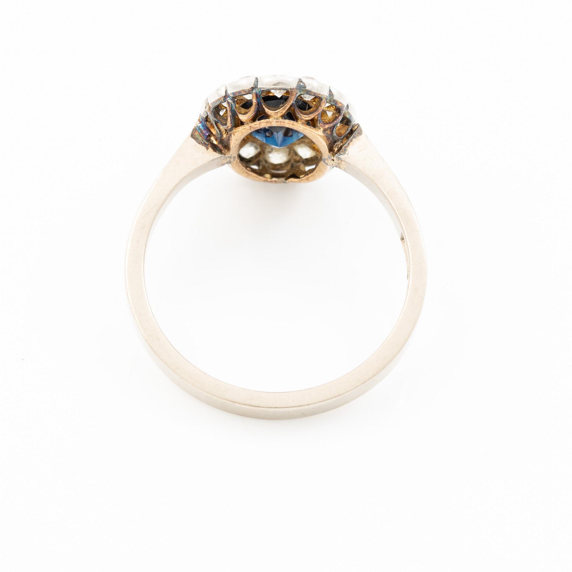 Ring, camrose model, 18K white gold with sapphire and old-cut diamonds.