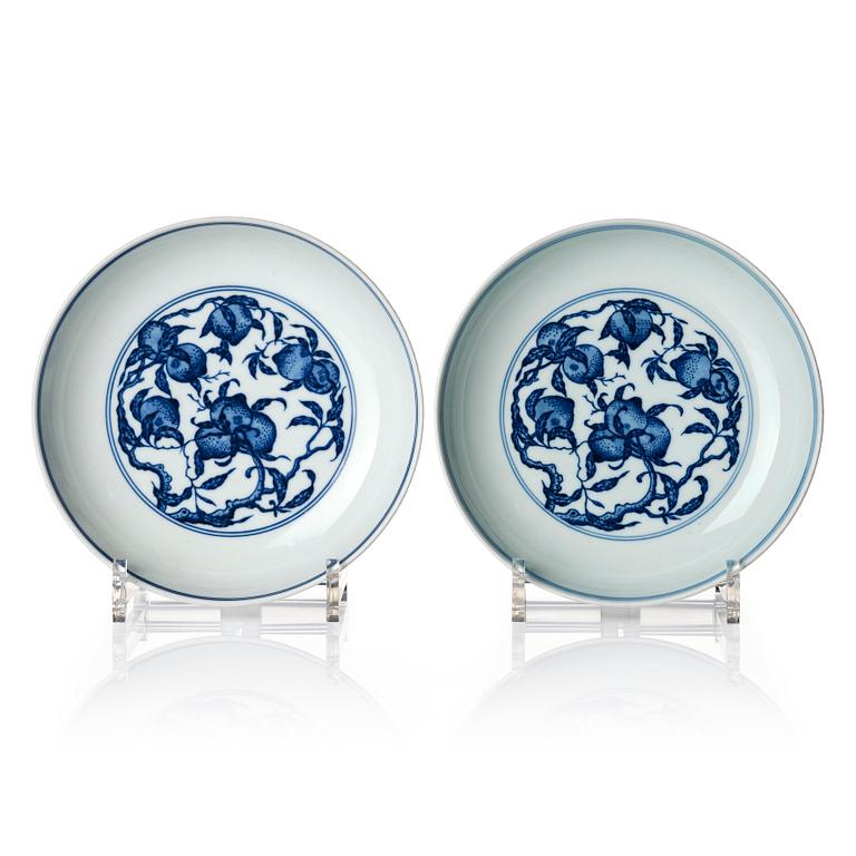 A pair of blue and white nine peaches dishes, presumably Republic, with Yongzheng mark.