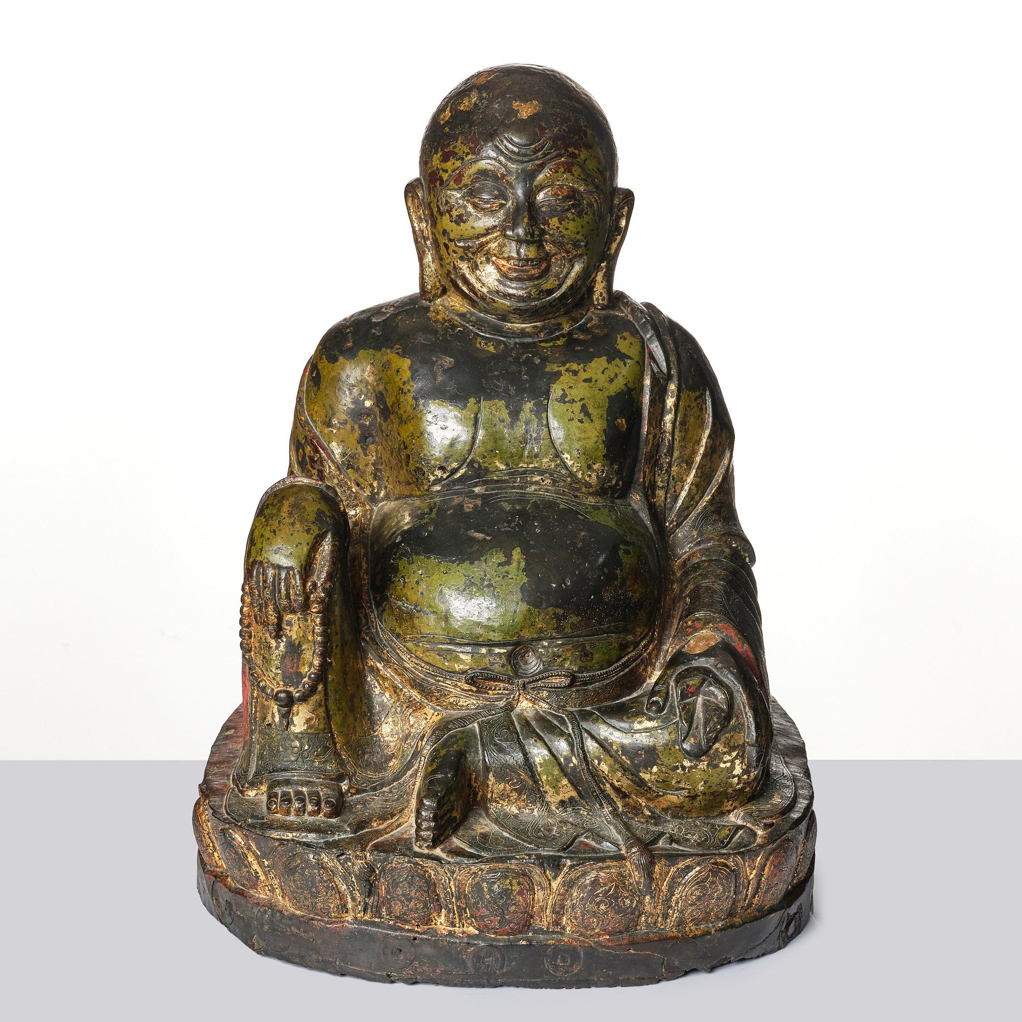 A large seated bronze figure of Budai, Ming Dynasty, dated to the fifth year of Jiajing (1526).
