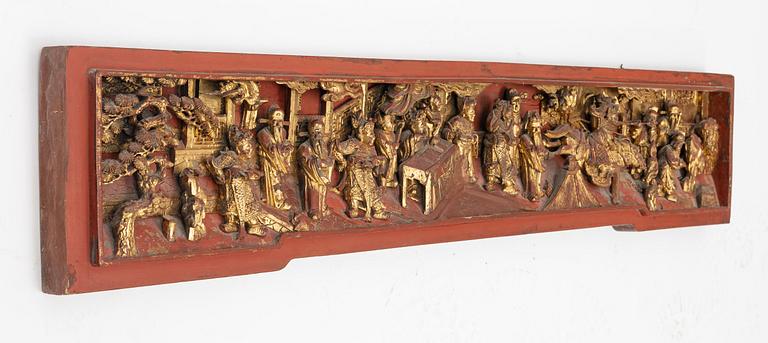 A carved wooden relief, China, late Qing dynasty, late 19th century.