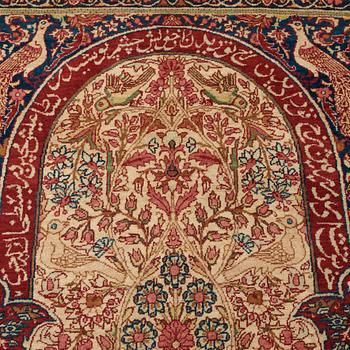 A RUG, an antique/semi-antique Kerman Laver  figural, ca 232,5 x 139,5 cm.