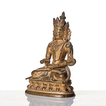 A gilt copper alloy figure of Amitayus, Tibeto - Chinese, 17th/18th century.