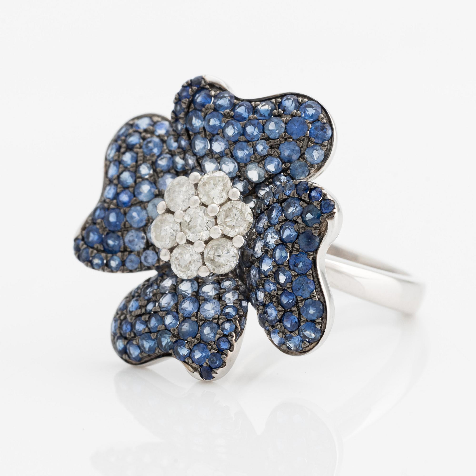 Ring in the shape of a flower with sapphires and brilliant-cut diamonds.