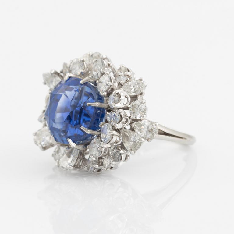 A platinum ring set with a faceted sapphire.