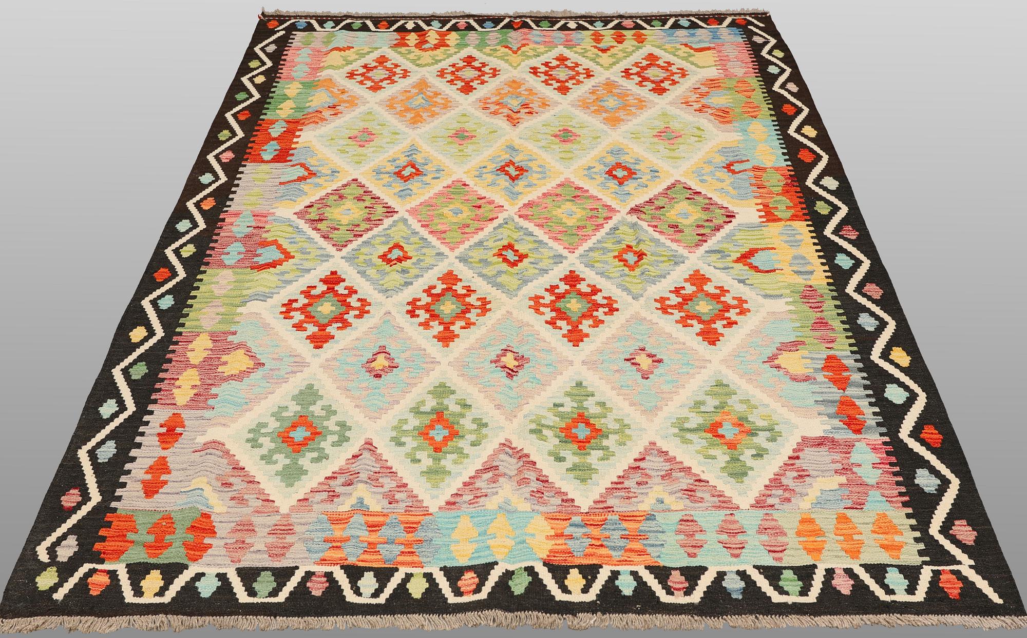 A kilim carpet, 241 x 182 cm.