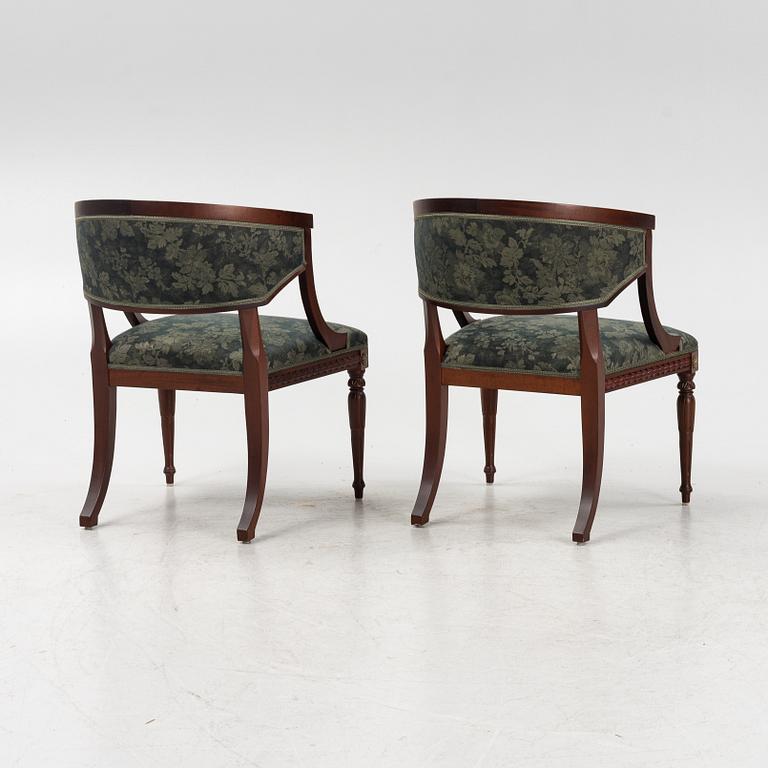 A pair of Gustavian style armrest chairs, second half of the 20th century.