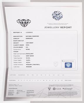 A pair of 18K white gold earrings with princess-cut diamonds ca. 3.60 ct in total. IGA certificate.