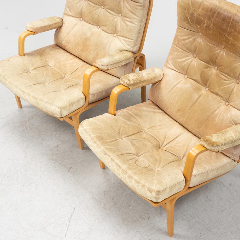 Bruno Mathsson, a pair of 'Ingrid' armchairs, Dux, Sweden, second half of the 20th century.
