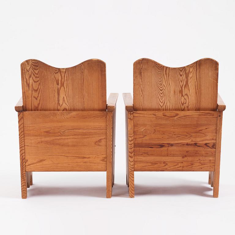 Axel Einar Hjorth, a pair of "Utö" stained pine armchairs, Nordiska Kompaniet 1930s.