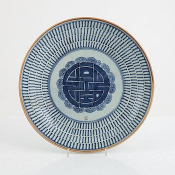 A blur and white dish, China, 19th century.
