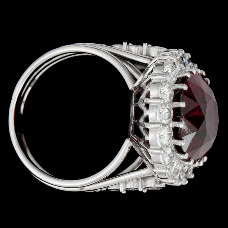 A natural red spinel, 11.15 cts, and diamond, circa 2.00 cts, ring.