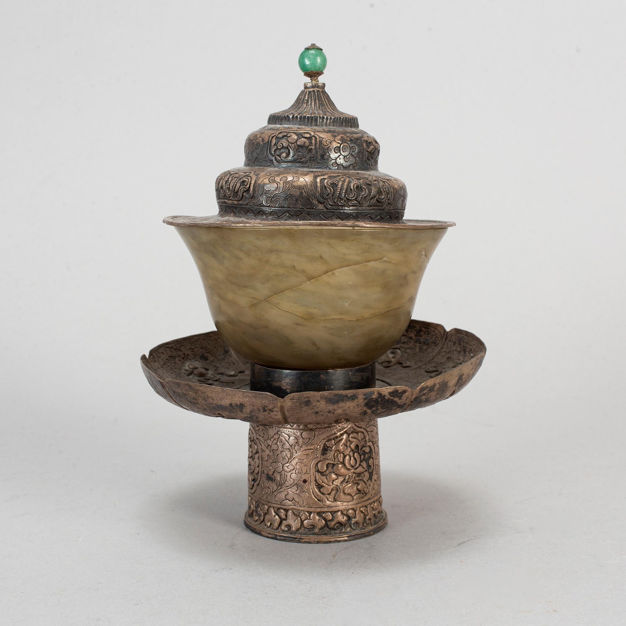 A tibetan bowl with stand and cover, 19th century.