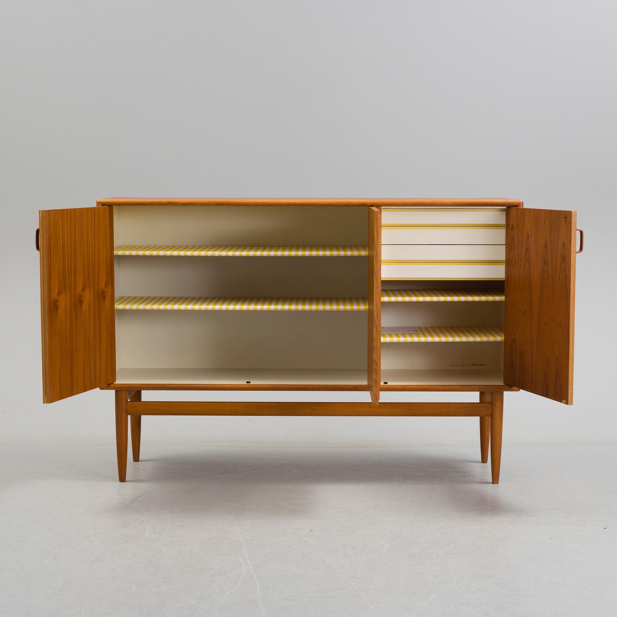 A second half of the 20th century teak veneered sideboard by Bertil Fridhagen, Bodafors, Sweden.