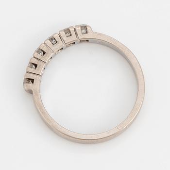 A ring set with six, round, brilliant-cut diamonds.