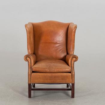 A LEATHER ARMCHAIR, second half of 20th century.