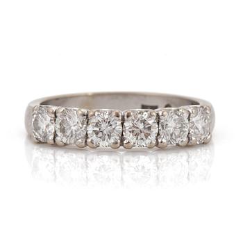 A half-eternity ring set with round, brilliant-cut diamonds.