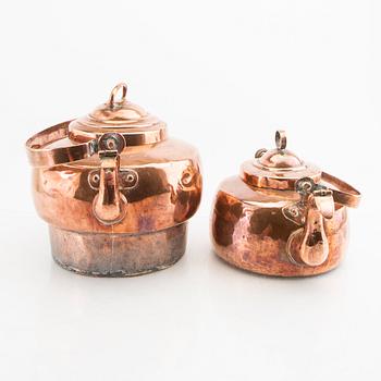 A pair of 19th century copper coffee pots.