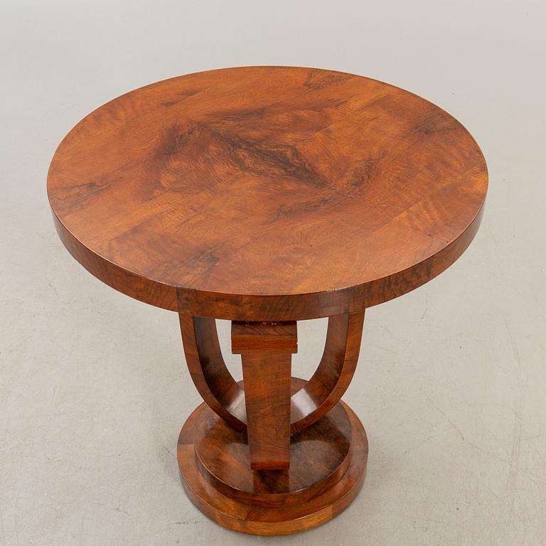 A walnut Art Deco style side table alter part of the 20t  century.