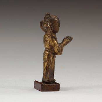 A gilt bronze figure of a standing boy, Ming dynasty, 15th/16th century.