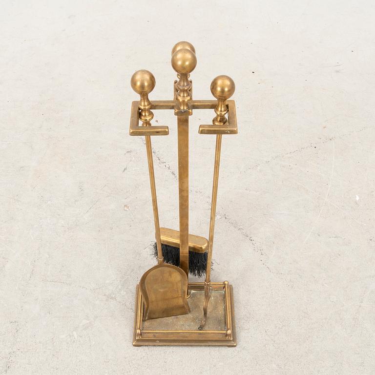 A sete of three brass fireirons and stand, first half of the 20th Century.