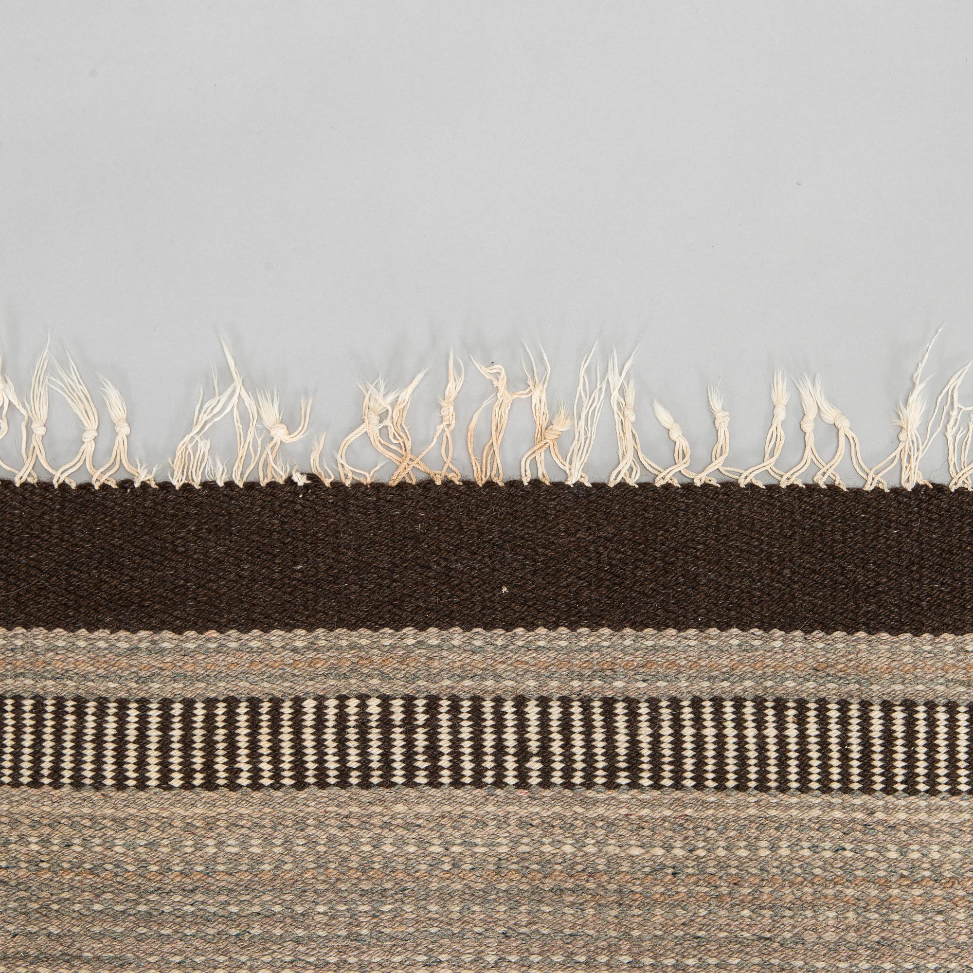 A 1930's Finnish flat weave carpet. Circa 245 x 180 cm.