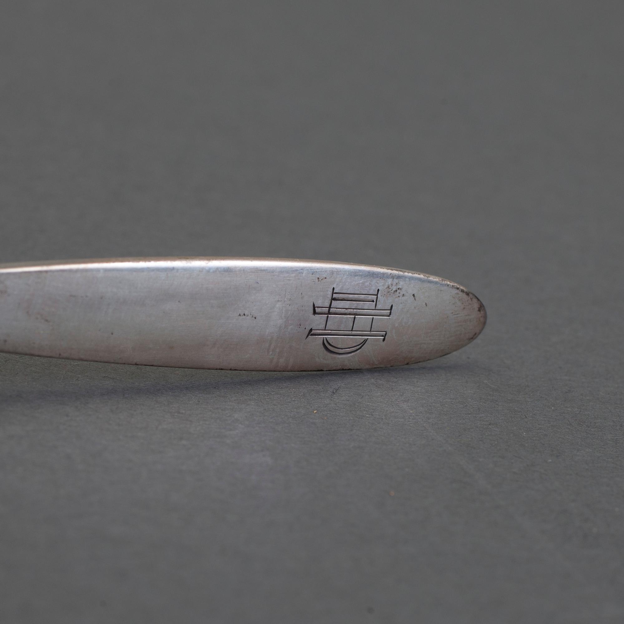 A set of 12+6 spoons by Georg Jensen,