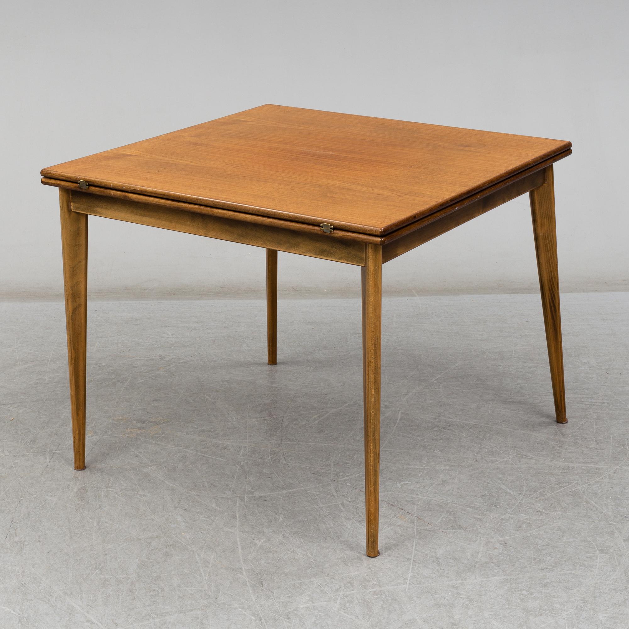 Four '829' chairs by Karl Axel Adolfsson, Gemla with an additional table.