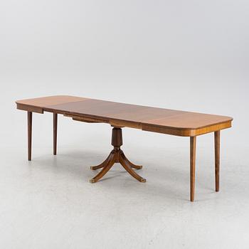 An mahogany veneered english style dining table, mid 20th century.