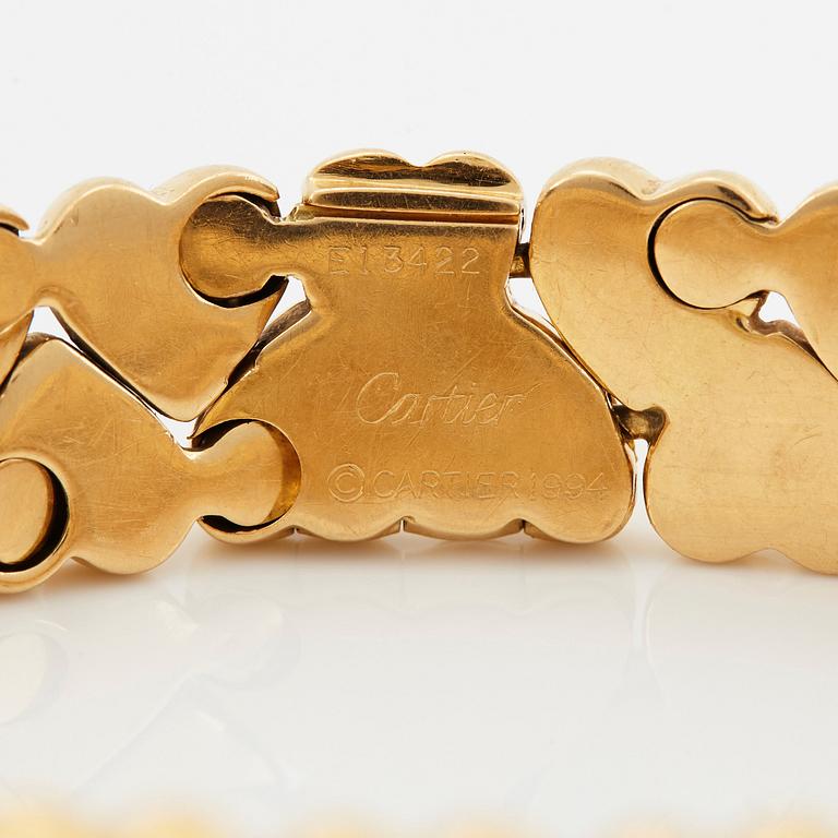 A Cartier 18K gold "Double Hearts" bracelet.