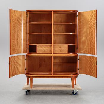 A mahogany veneered cabinet, mid 20th Century.