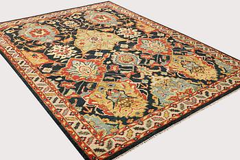 An oriental carpet with Mamluk design, a. 331 x 274 cm.