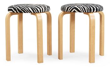 A pair of Alvar Aalto stools for Artek, Finland 2002.