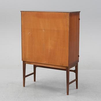 A beech and mahogany mid 20th century cabinet.