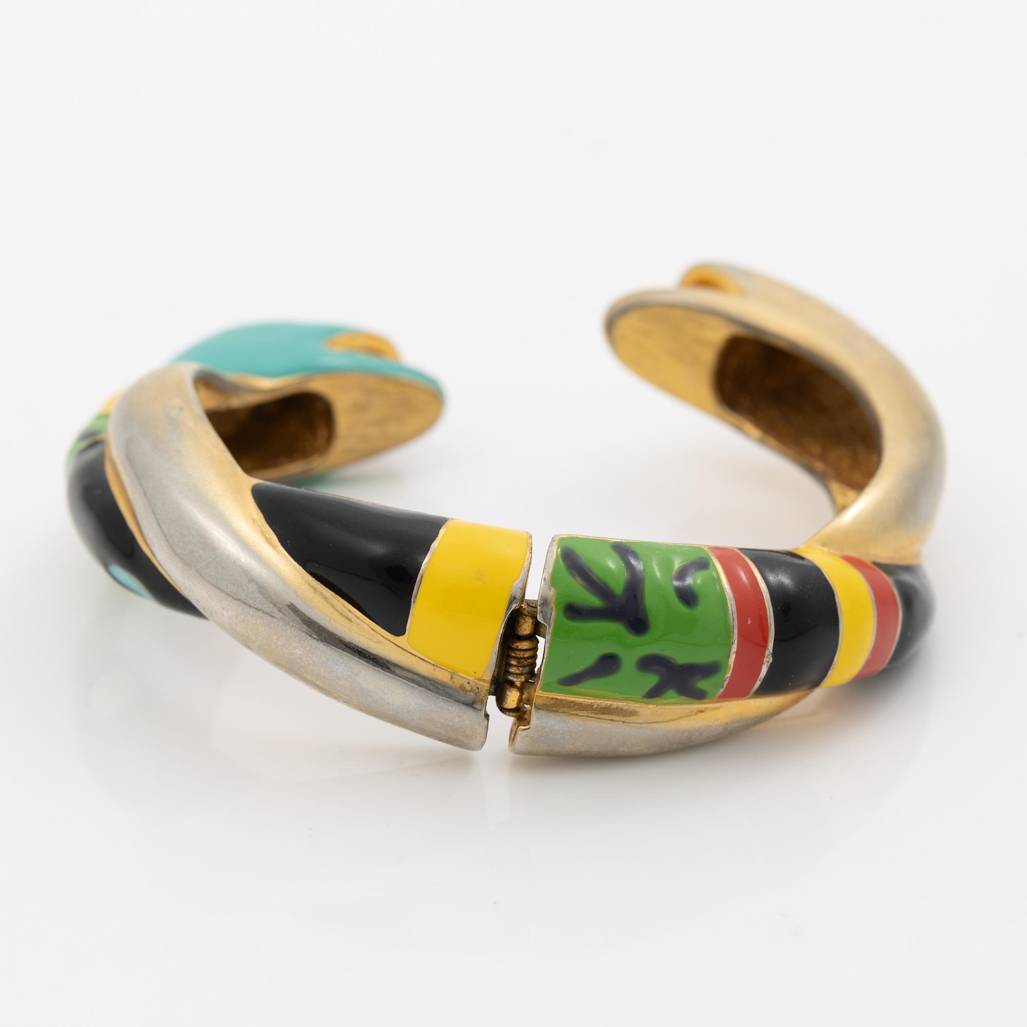 Niki de Saint Phalle , armband, "serpentine bracelet" guldfärgad metall med emalj.