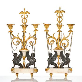 A pair of Louis XVI three lights Candelabra, Parisian works, in the manner of François Rémond, late 18th century.