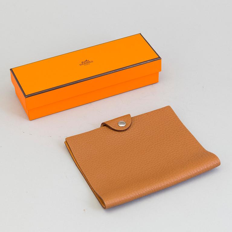 A leather Hermès notebook case.