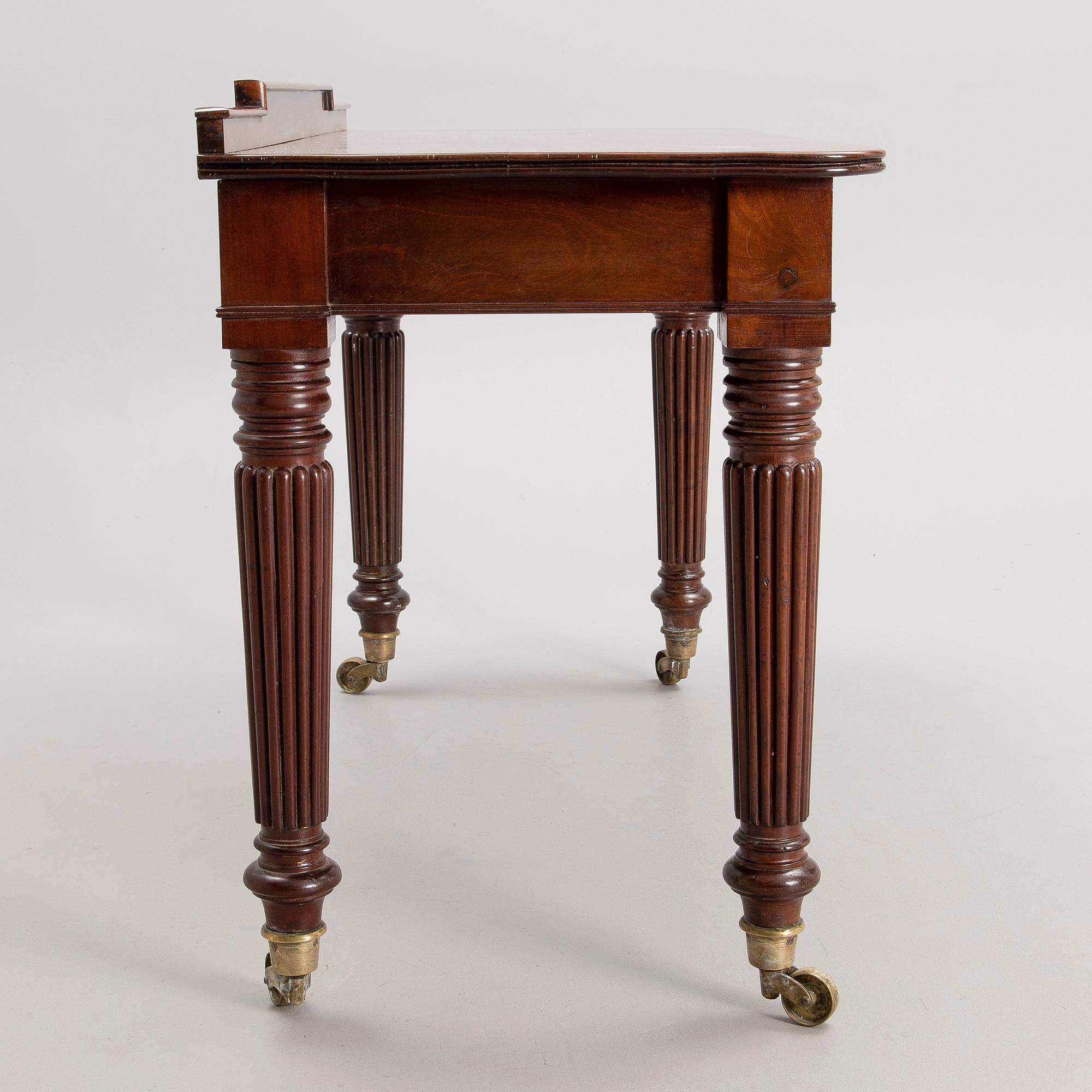 A Victorian mahogany table, latter half of the 19th century.