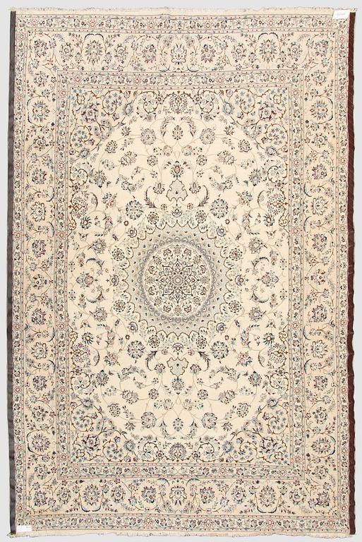 A carpet, Nain, part silk s.k 9LAA. Circa 376 x 249 cm.