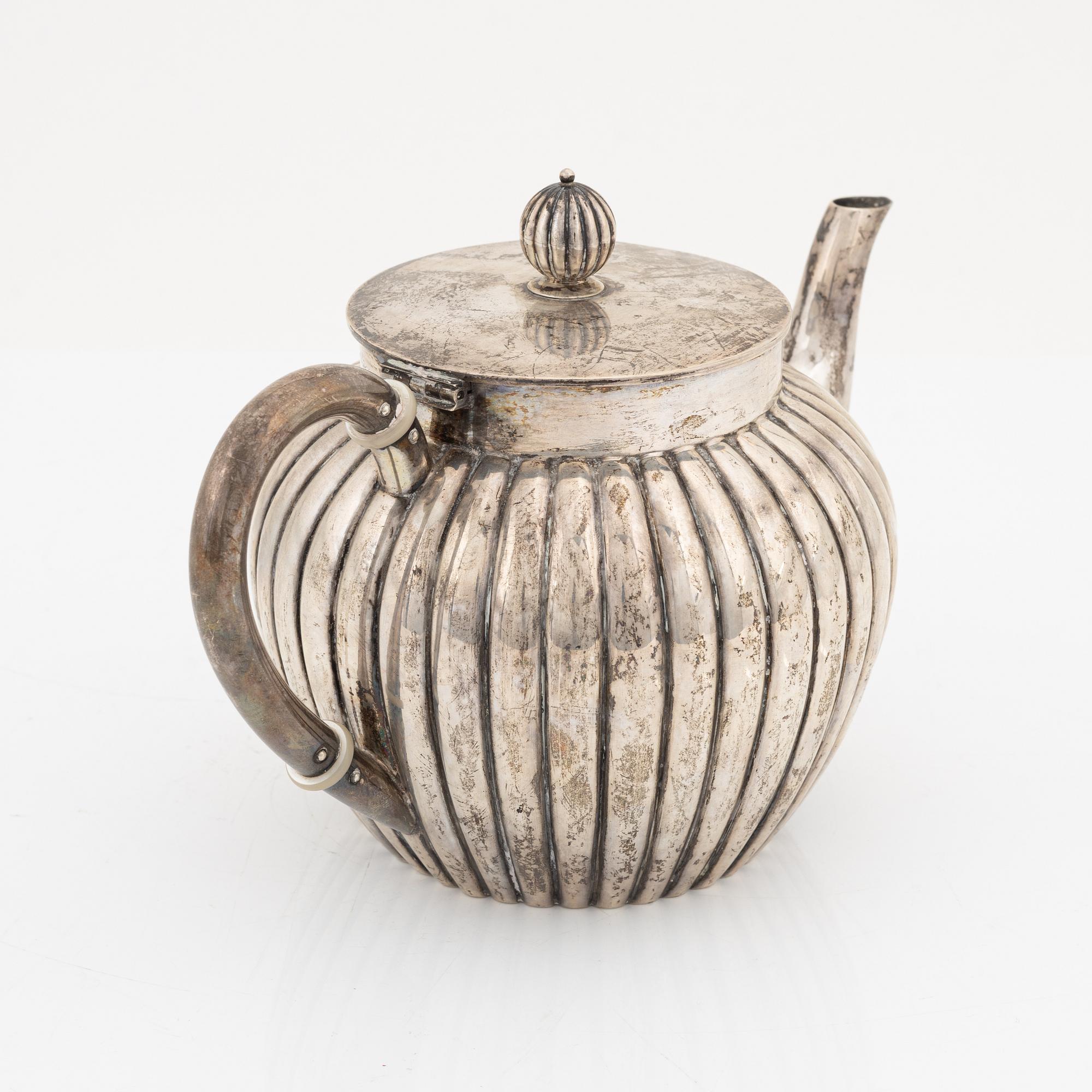 A silver teapot, bearing the mark of K. Andersson, Stcokholm, 1905.