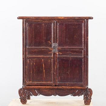 A 19TH CENTURY CHINESE CUPBOARD.