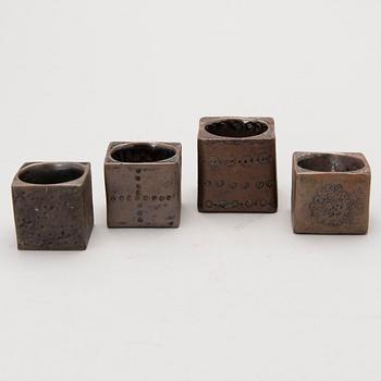 Four stoneware cruets, signed Bryk.