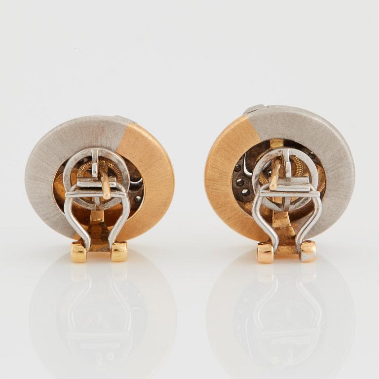 A pair of Paul Binder earrings in 18K gold and white gold set with round brilliant-cut diamonds.