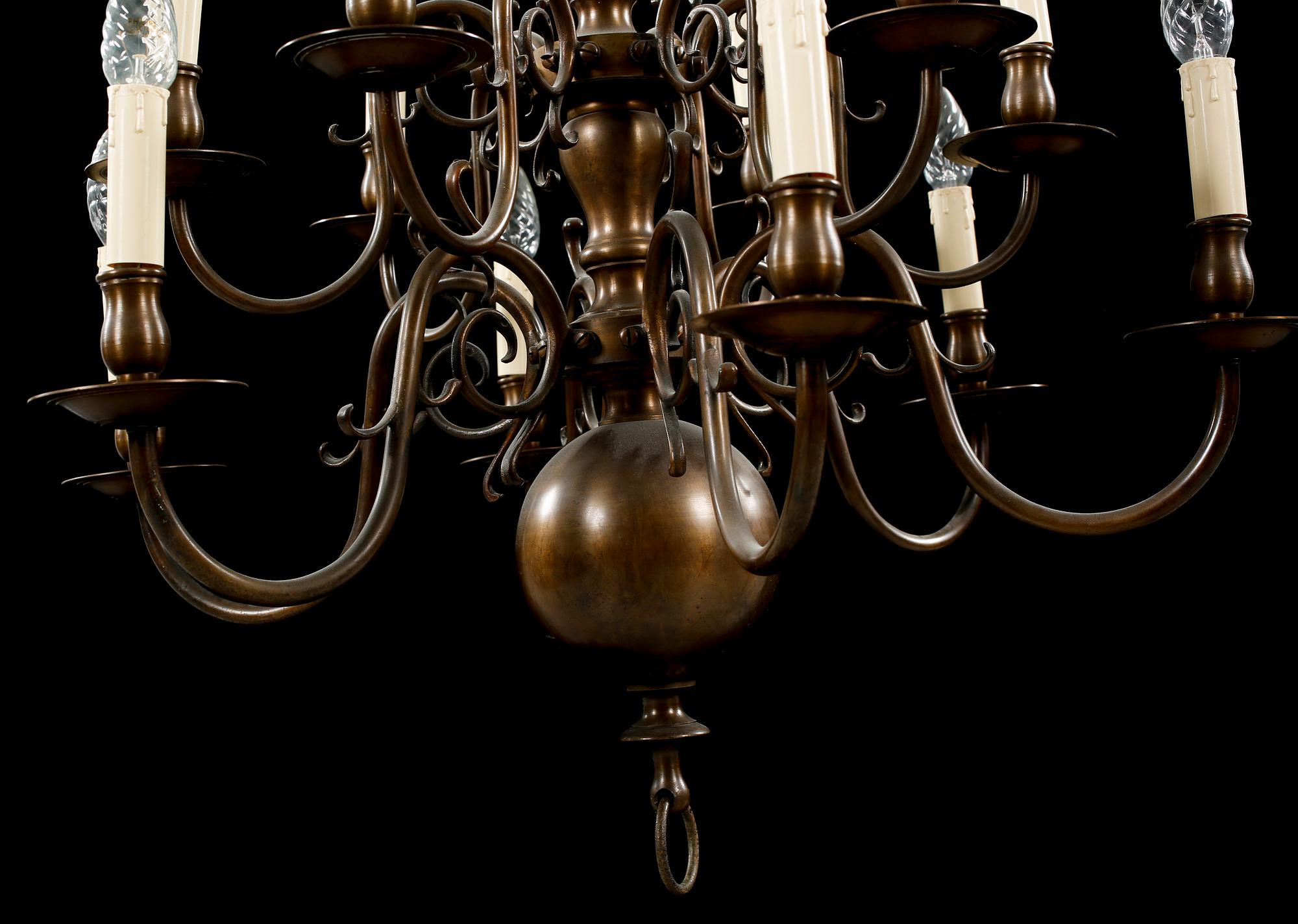 A patinated brass chandelier, first half of the 20th century. Height excl. chain ca 75 cm.