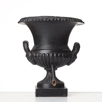 A Louis XVI-style garden urn, circa 1900.