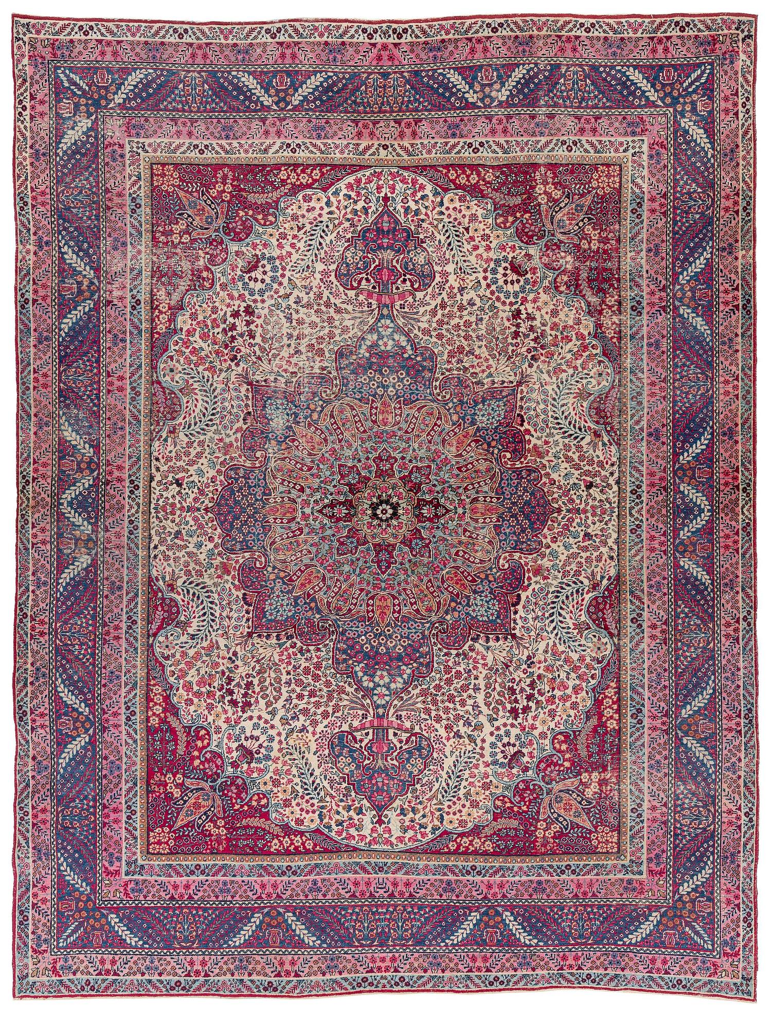 A semi-antique Kirman carpet, South Persia, c. 380 x 289 cm.