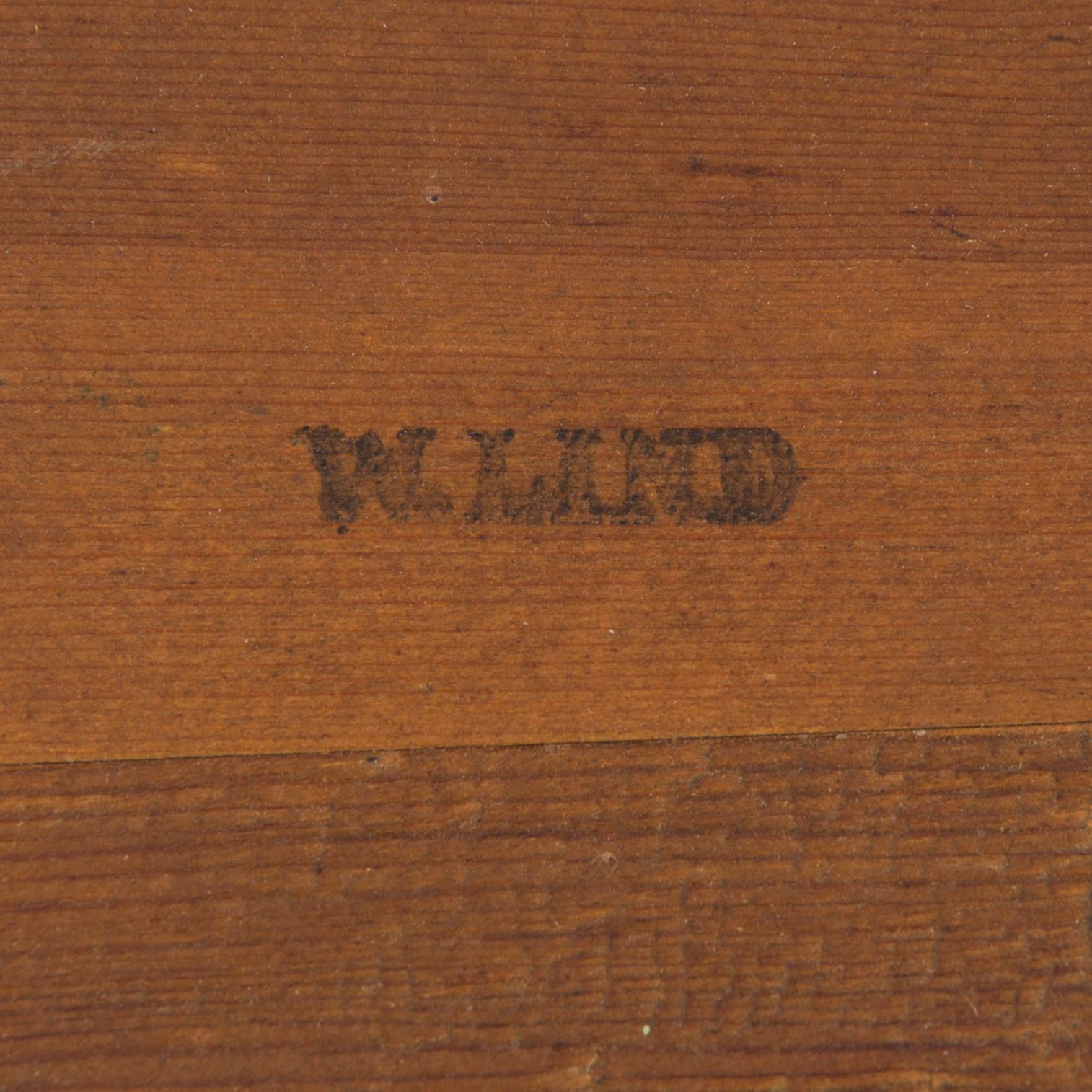 An Empire mirror marked W Lind, first half of the 19th century.