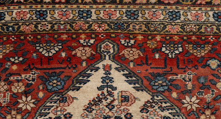 A Bakhtiari carpet, signed, c. 580 x 212 cm.