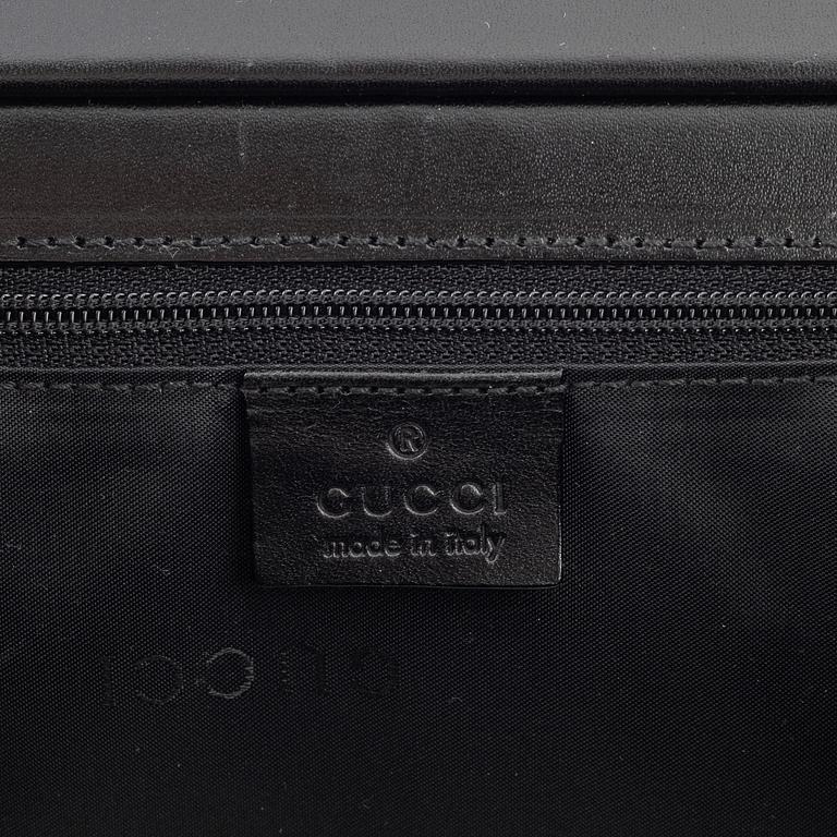 Gucci, a nylon handbag.